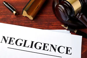 Negligence form, documents and gavel on a table
